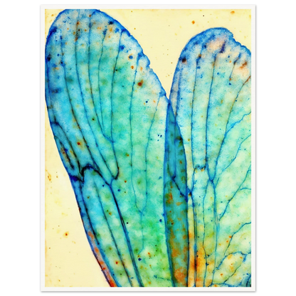 Delicate translucent blue wings with intricate vein patterns, softly glowing against a pale background with watercolor speckles.