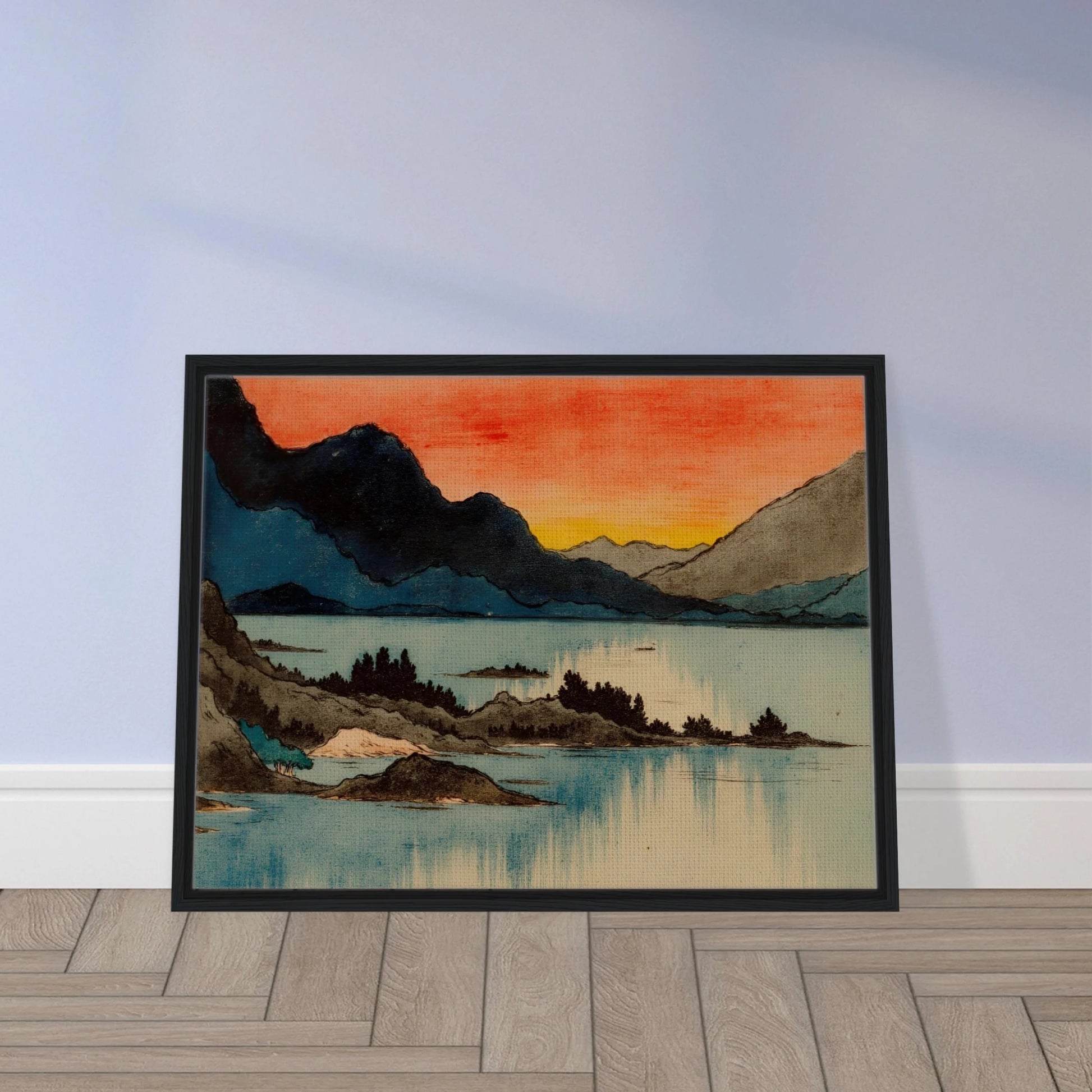 Layered mountain silhouettes meet a glowing red and yellow sunset above calm blue lake waters in a serene scenic view.