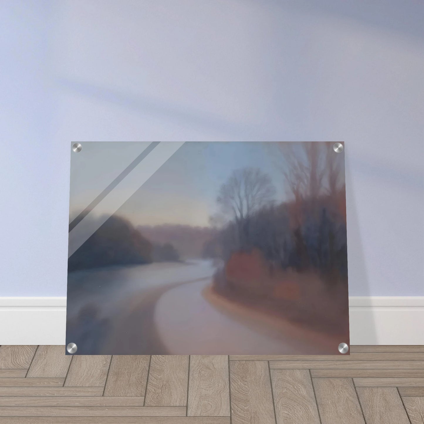 A soft river curves through misty woodlands at dusk, with blurred trees fading into gentle blue and mauve tones.