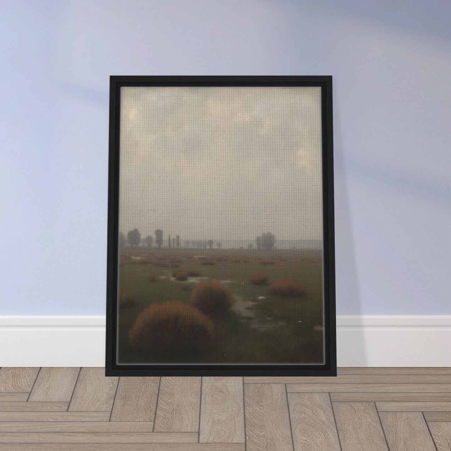 A misty field with distant trees under a pale sky, capturing the quiet stillness of a fog-laden morning.