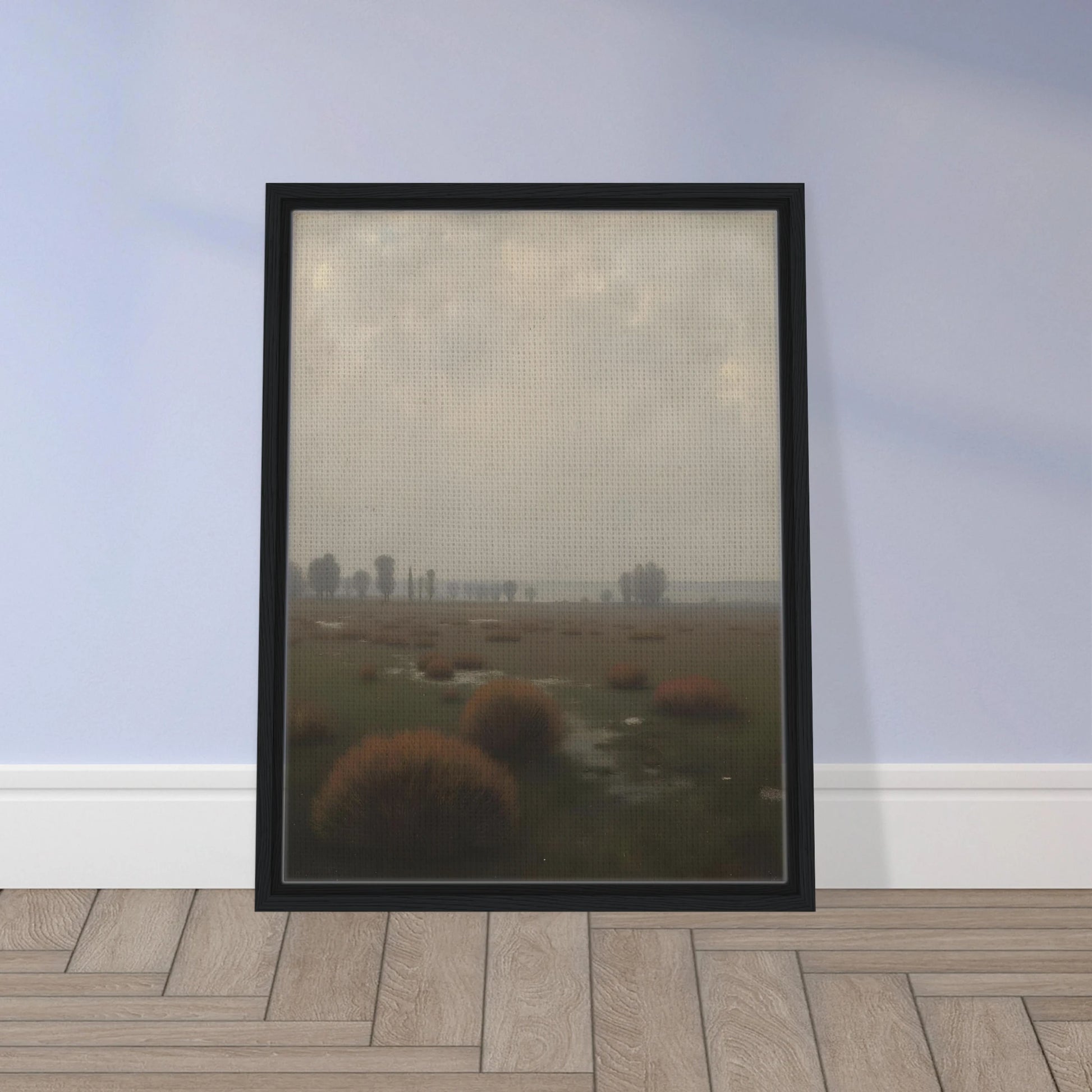 A misty field with distant trees under a pale sky, capturing the quiet stillness of a fog-laden morning.