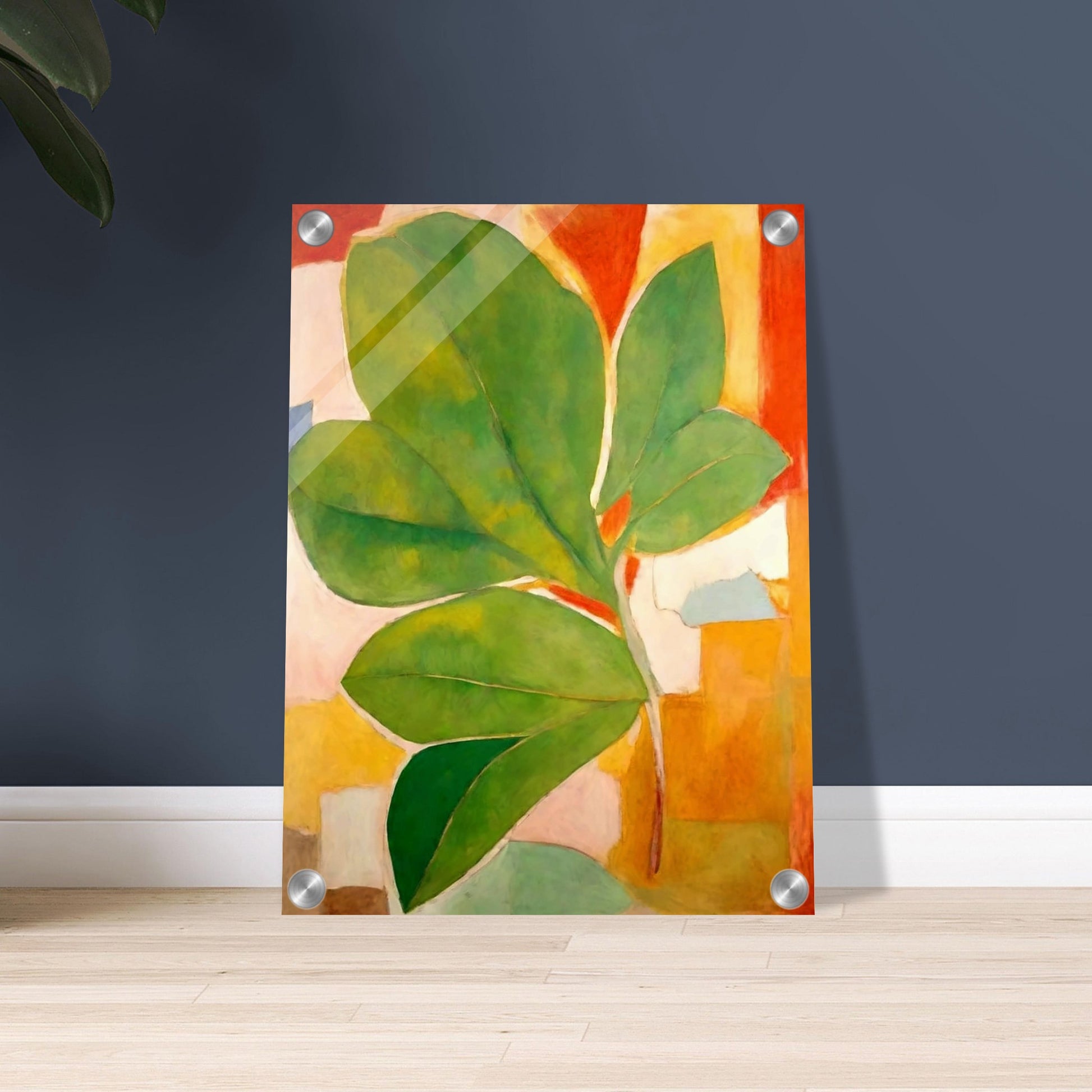 A large green leaf stands out against a background of abstract shapes in warm hues of orange, red, and beige, creating a striking composition of color and form.