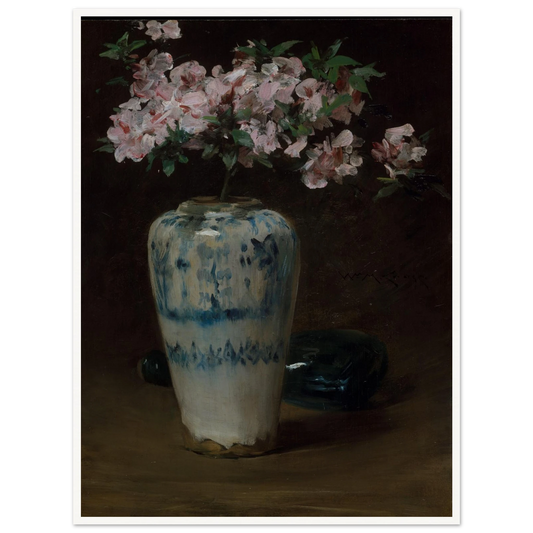 Pink azaleas bloom from a blue and white Chinese vase against a dark background