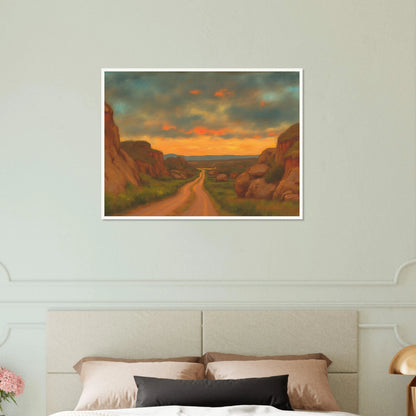 A winding dirt road cuts through rocky hills under a glowing sunset sky, evoking peace, wanderlust, and quiet reflection.
