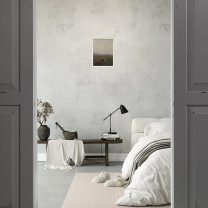 A misty field with distant trees under a pale sky, capturing the quiet stillness of a fog-laden morning.