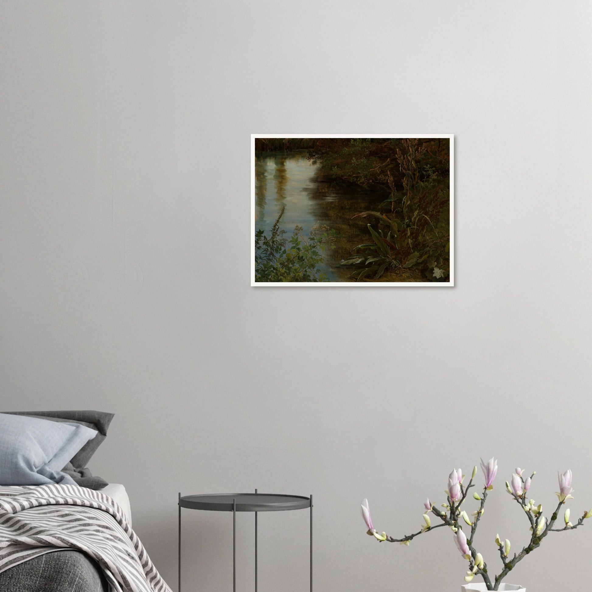 Calm water reflects trees beside dense riverbank plants and grasses