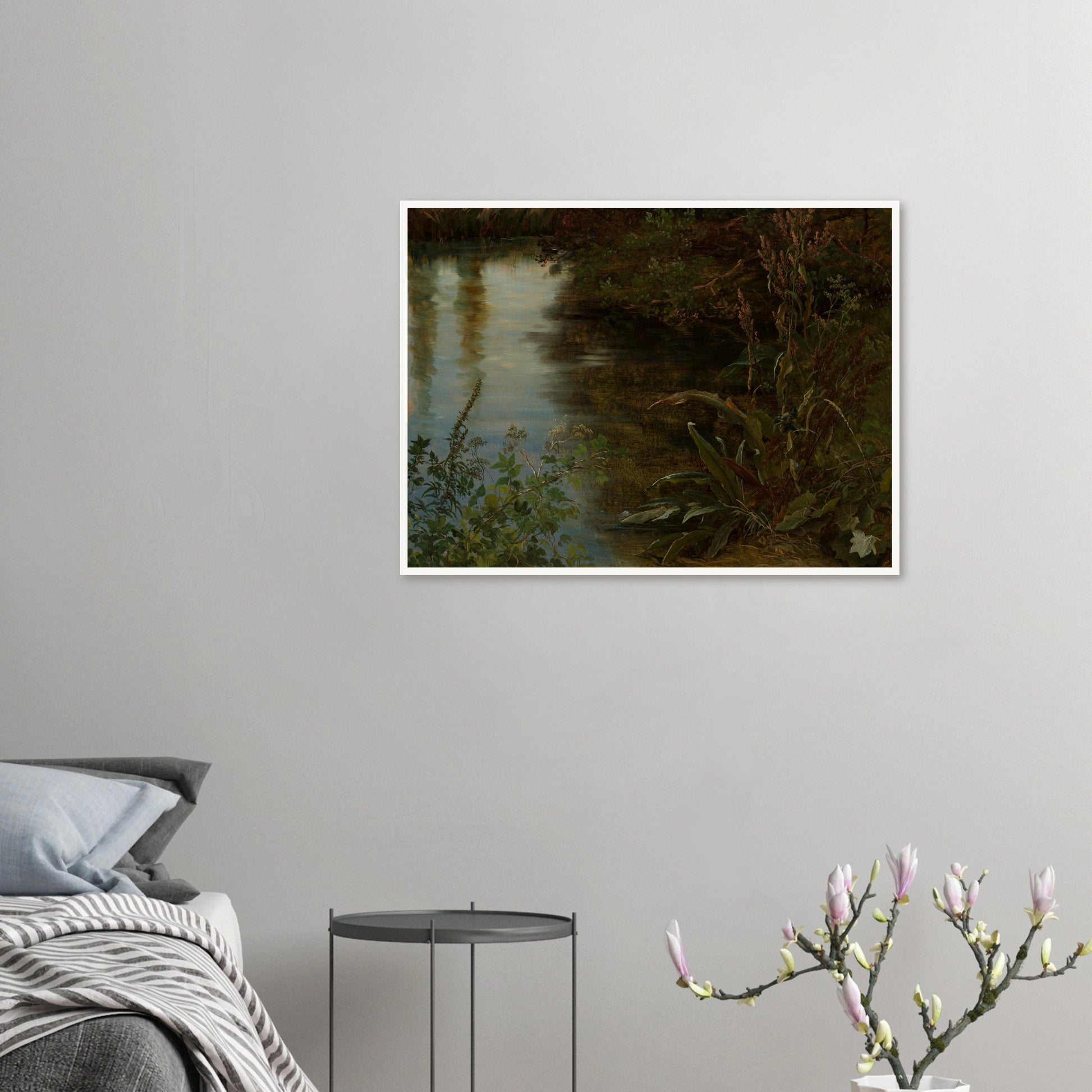 Calm water reflects trees beside dense riverbank plants and grasses