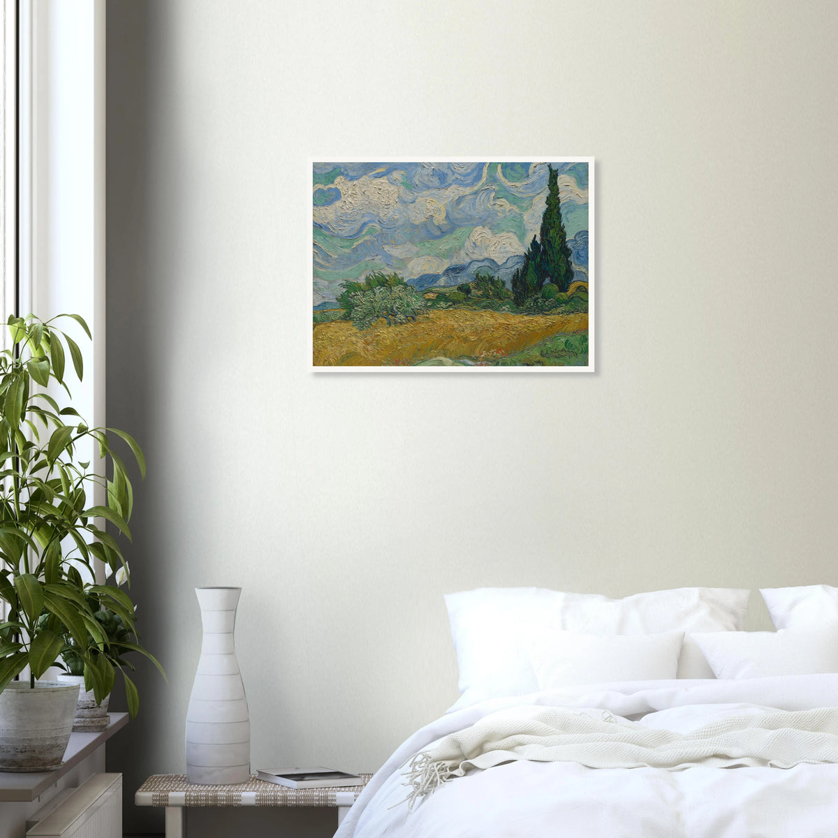 Golden wheat field and dark cypress trees beneath swirling blue-and-white clouds in a vivid Provençal landscape.