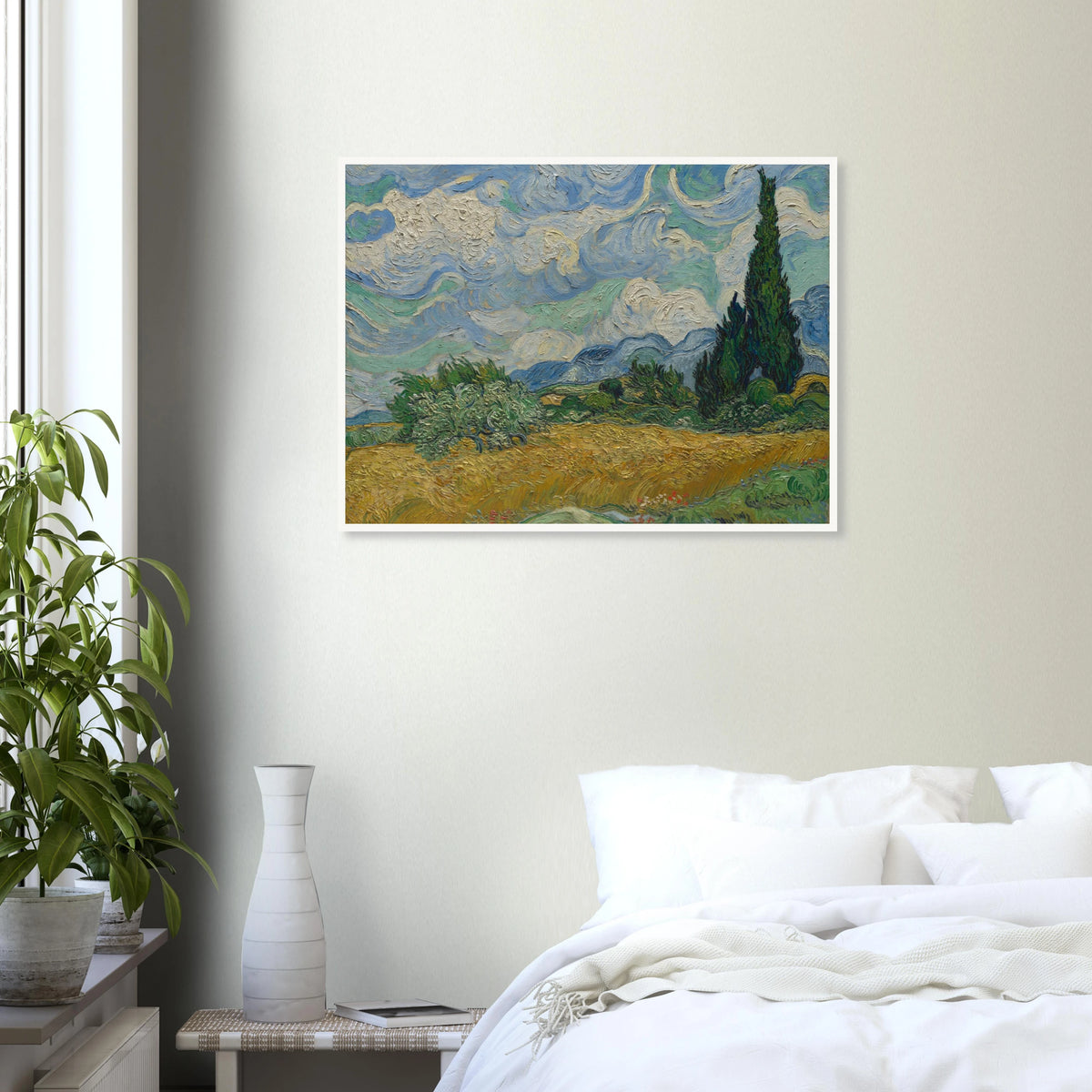 Golden wheat field and dark cypress trees beneath swirling blue-and-white clouds in a vivid Provençal landscape.