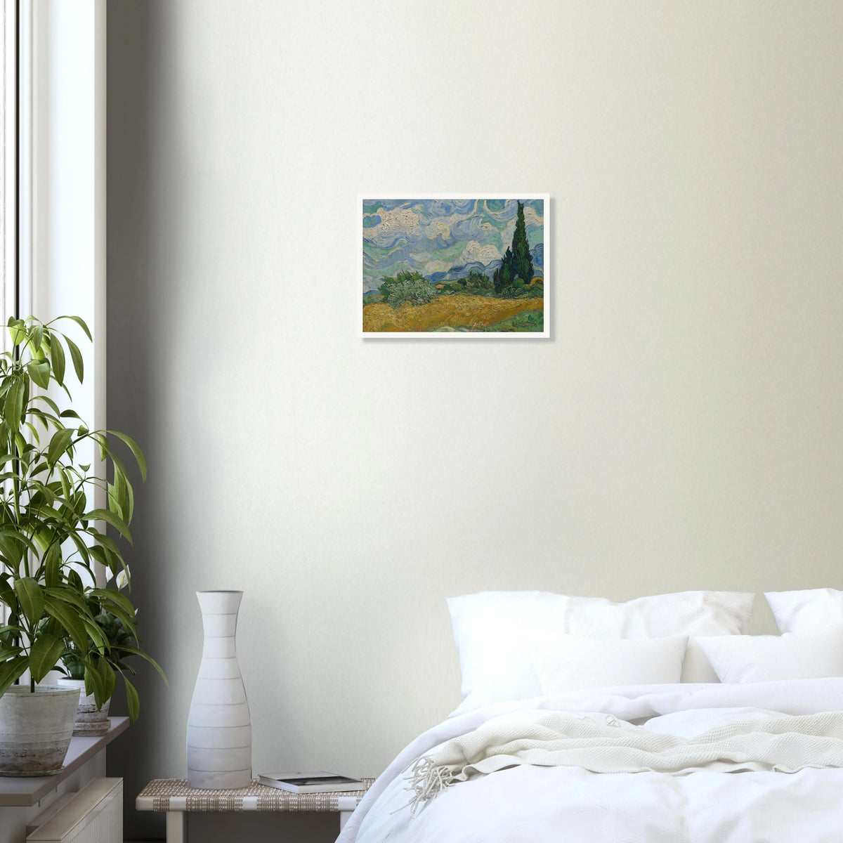 Golden wheat field and dark cypress trees beneath swirling blue-and-white clouds in a vivid Provençal landscape.
