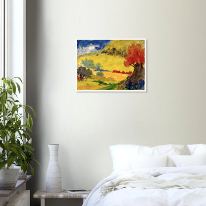 Red tree rises beside golden hills, green fields, and a deep blue sky in a bright countryside scene.
