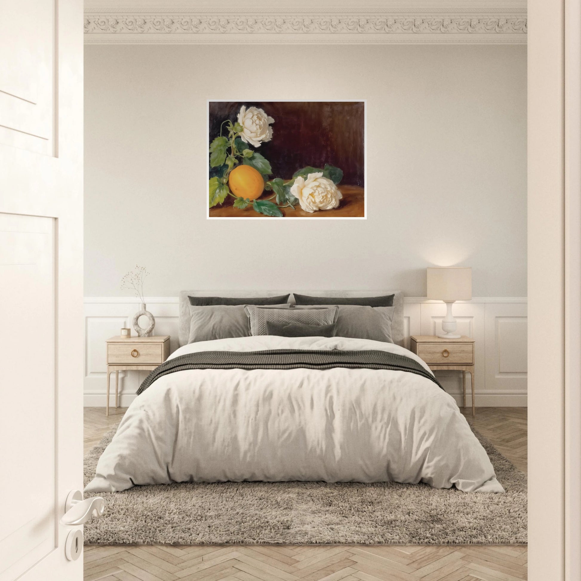 Cream roses and a golden lemon rest among lush green leaves against a rich dark backdrop with timeless elegance.