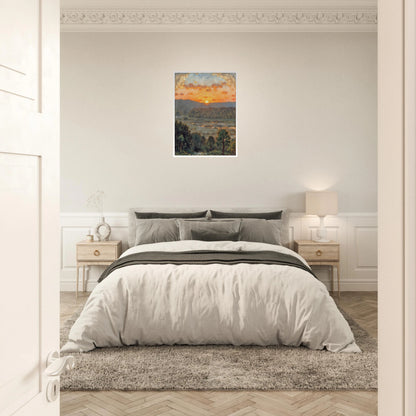 A glowing sunset over misty hills and a river valley, where the sky burns in orange light above soft green trees.