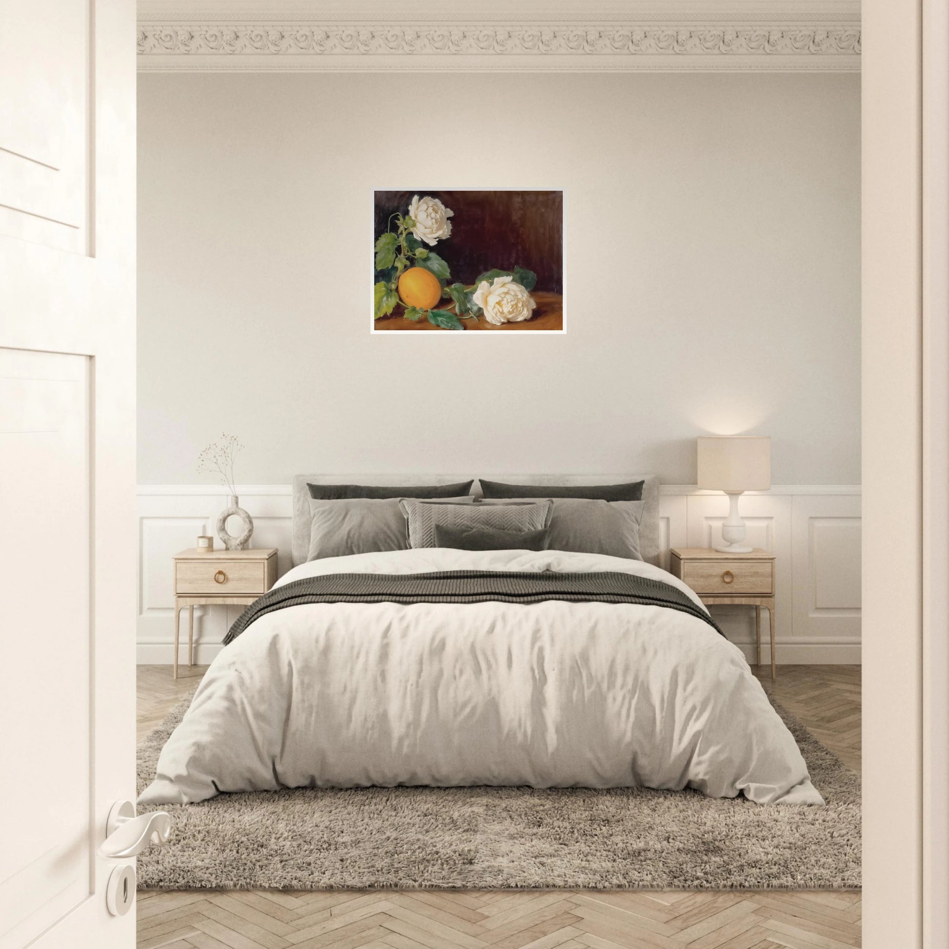 Cream roses and a golden lemon rest among lush green leaves against a rich dark backdrop with timeless elegance.