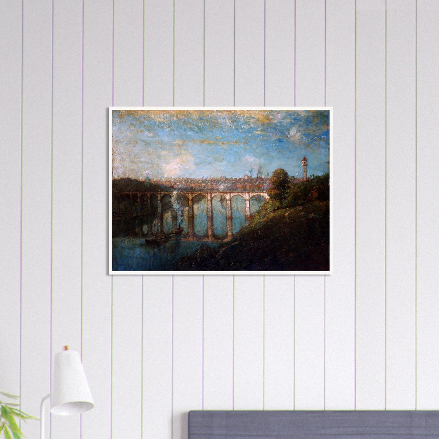 Arched bridge spans a blue river beneath a city skyline and tall tower
