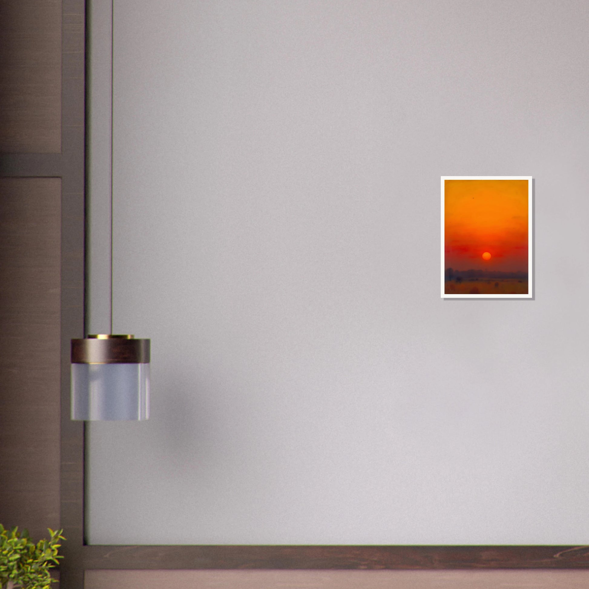 A golden-orange sunset over a hazy horizon, with the sun glowing in a vivid red and amber sky.