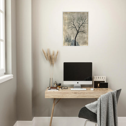Two leafless trees stand silhouetted against a misty gray sky, evoking a quiet, contemplative atmosphere.