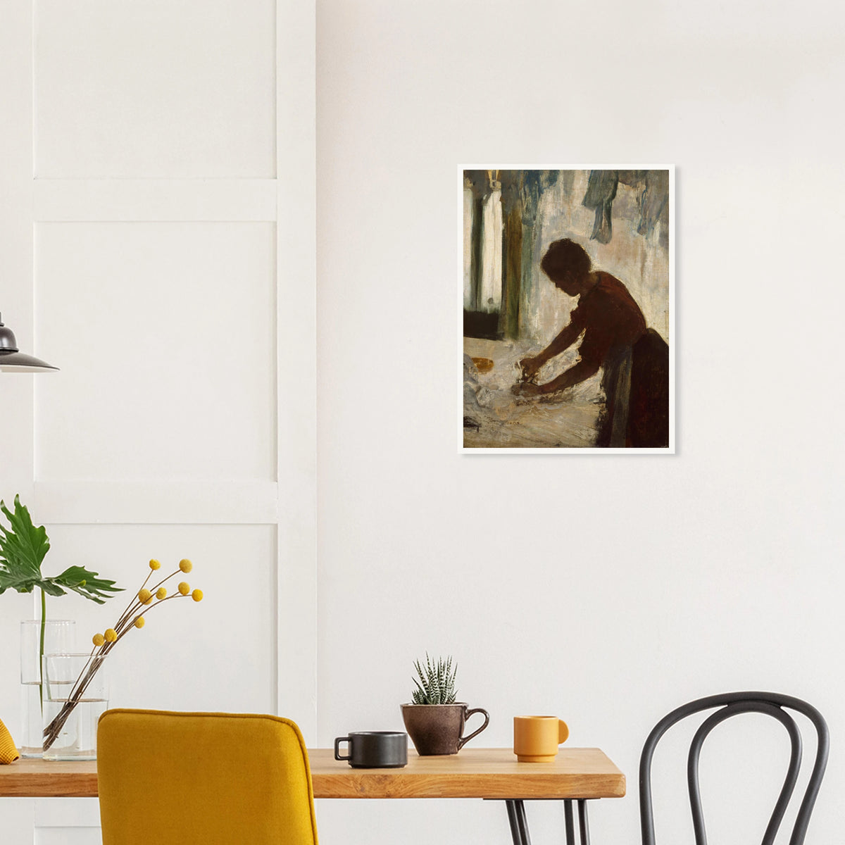 A woman leans over a table ironing white fabric, silhouetted against a softly lit laundry interior.