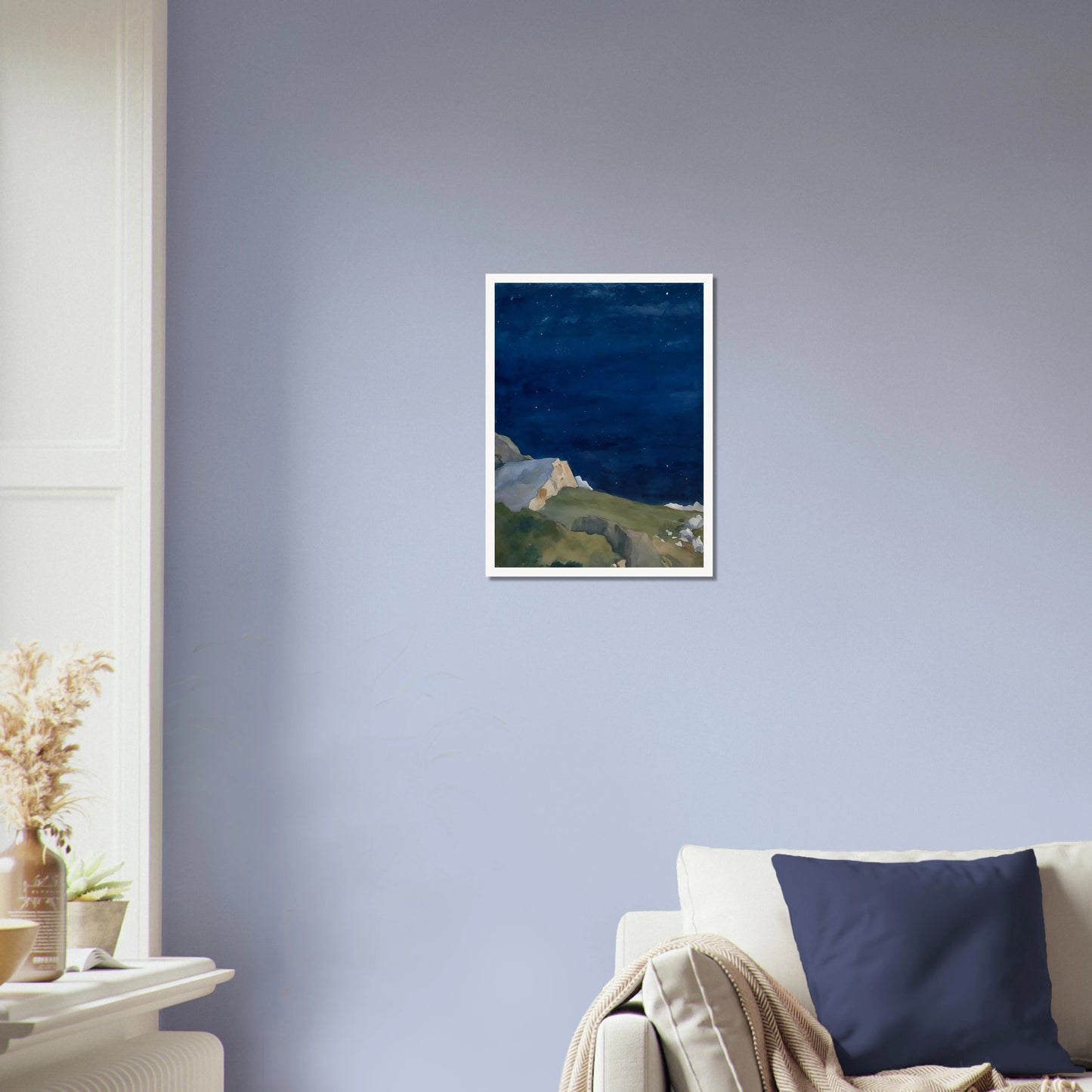 A tranquil night scene of rocky cliffs under a starlit indigo sky, evoking solitude and quiet wonder.