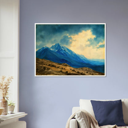 Majestic blue mountain peaks rise above golden rolling plains beneath luminous clouds, blending grandeur, distance, and tranquil wilderness.