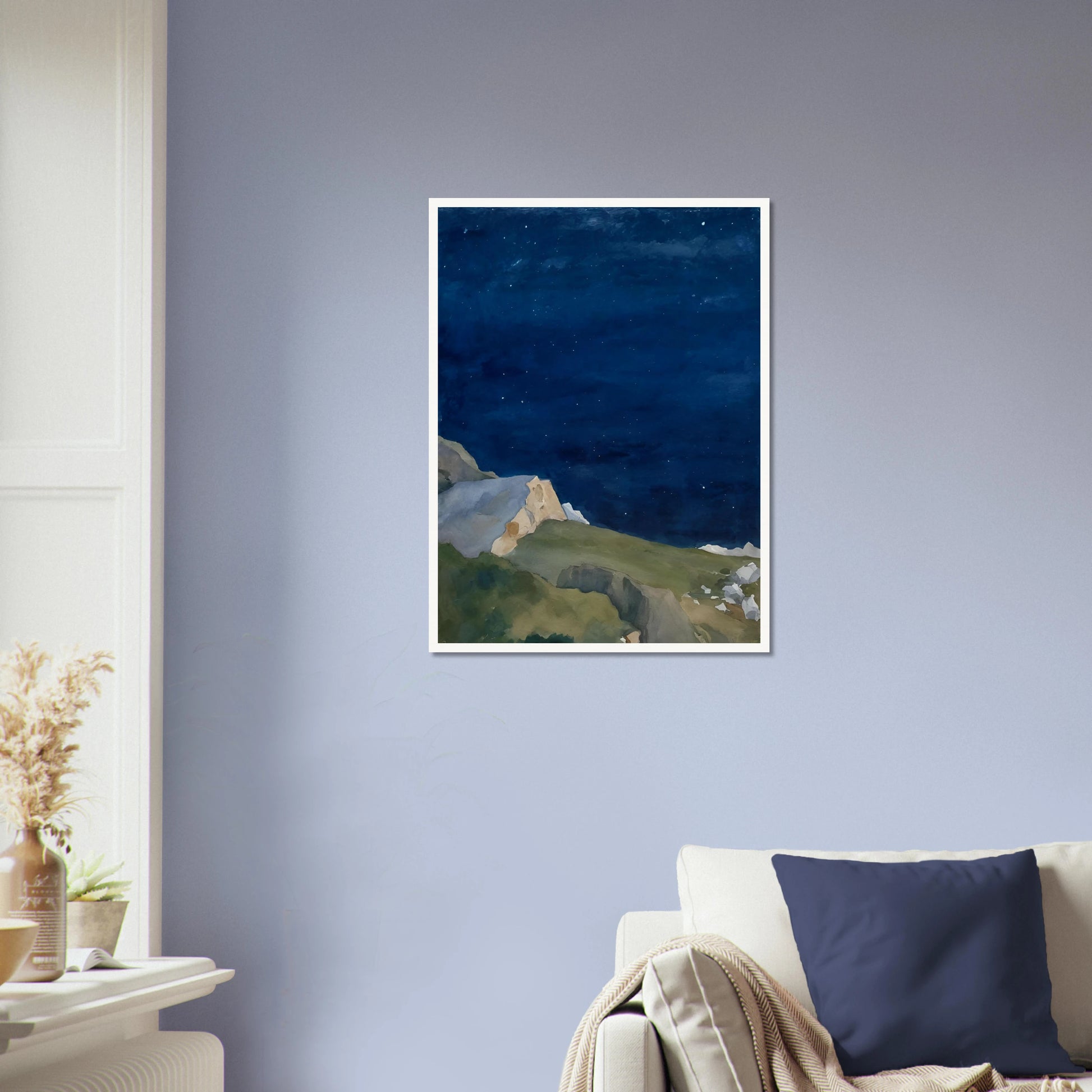 A tranquil night scene of rocky cliffs under a starlit indigo sky, evoking solitude and quiet wonder.