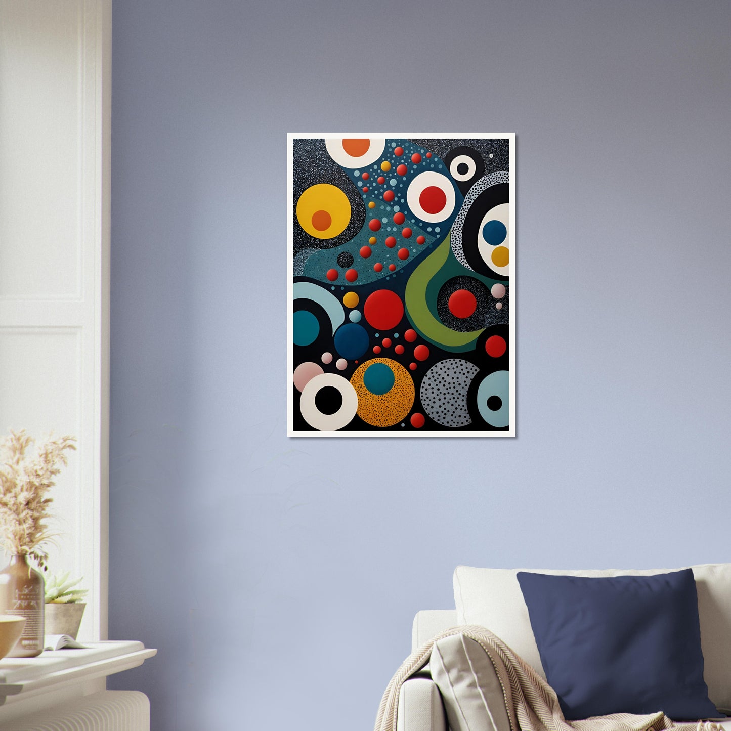 A vibrant geometric painting with bold circles, dots, and flowing shapes in red, blue, yellow, and black, resembling a cosmic abstract scene.