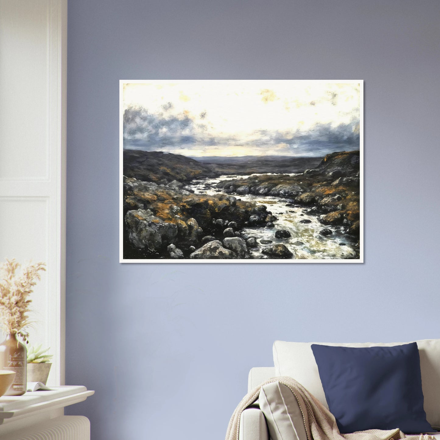 A rugged river winds through rocky highlands beneath dramatic clouds, blending silver waters with earthy terrain and distant horizons.