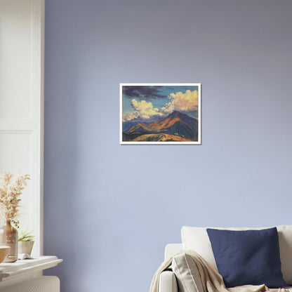 Sunlit mountain peaks glow beneath towering cream clouds and deep blue skies, with warm ridges stretching across an open landscape.