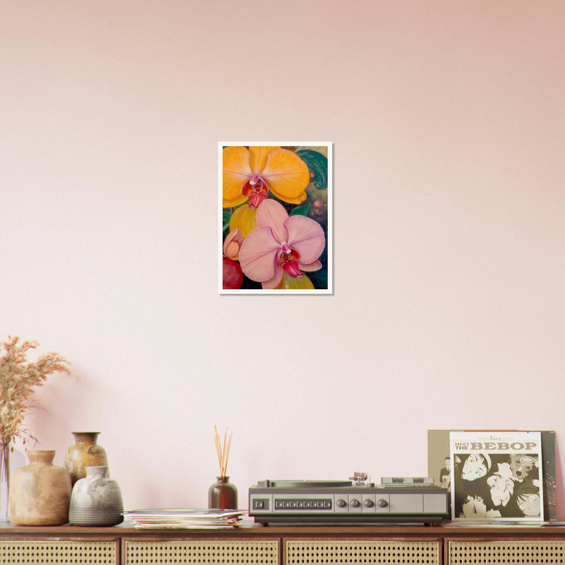 A vibrant floral painting featuring large blooming orchids in shades of golden yellow and soft blush pink, with rich magenta centers set against a dark, decorative background with lush green accents.