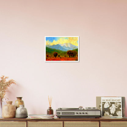 Warm autumn trees stretch across a fiery red field with misty blue mountains and a glowing yellow sky in the distance.
