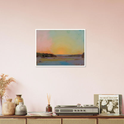 A pastel-toned sunrise casts soft pink, yellow, and blue hues over tranquil open fields bordered by distant trees.