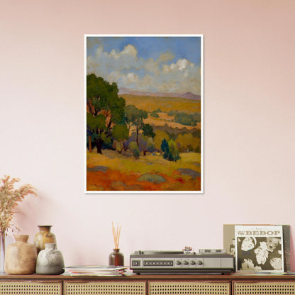 Golden fields and green trees stretch beneath a blue sky with soft clouds and distant hills.