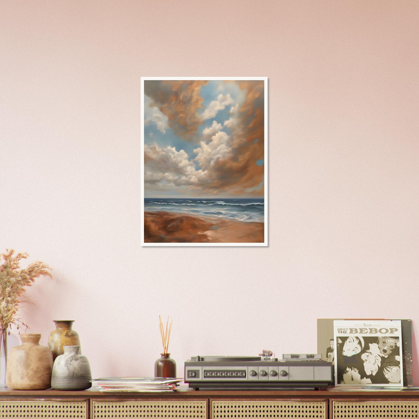 A breathtaking seascape with soft waves rolling onto a sandy shore beneath a sky filled with billowing golden clouds against a serene blue backdrop.