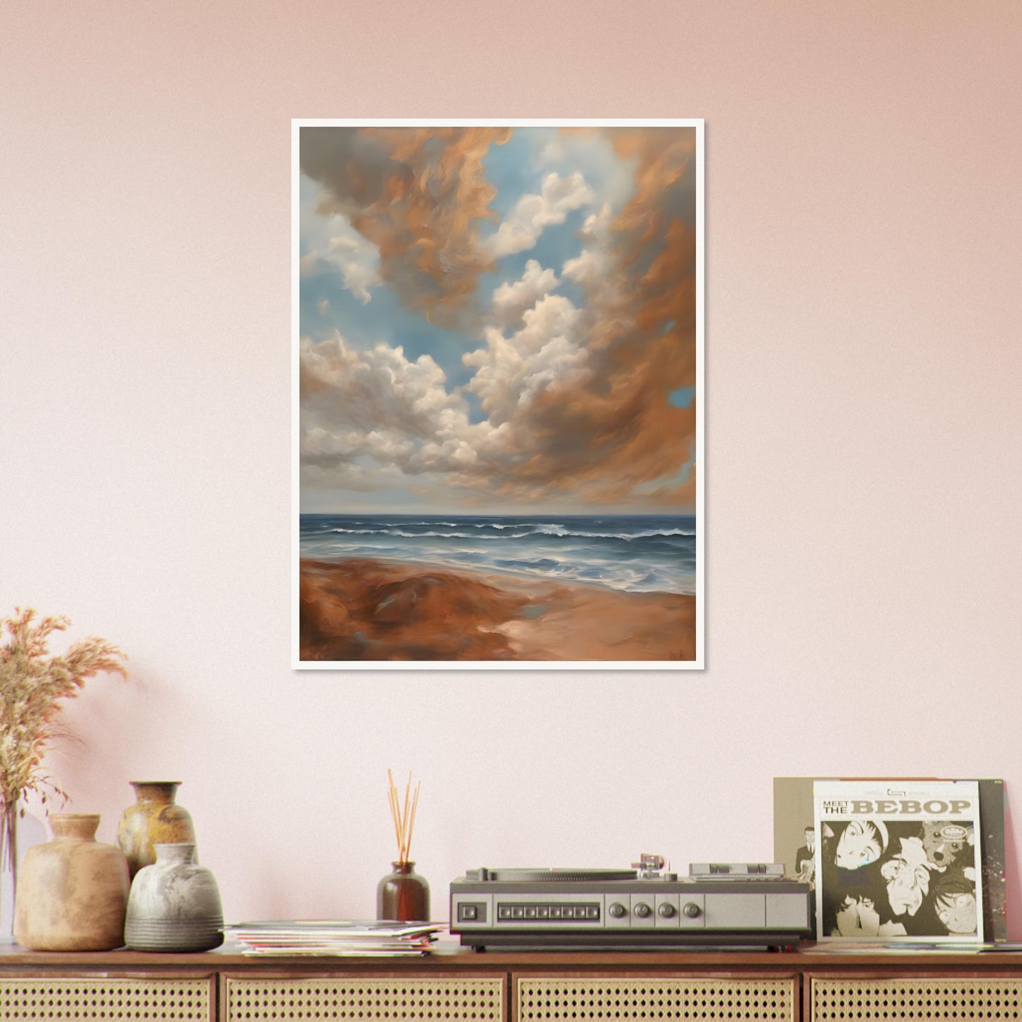 A breathtaking seascape with soft waves rolling onto a sandy shore beneath a sky filled with billowing golden clouds against a serene blue backdrop.