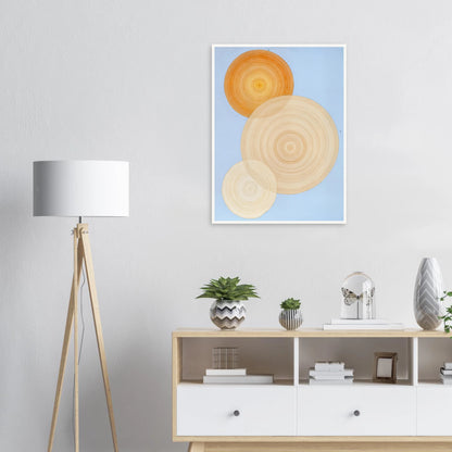 Three overlapping concentric circles in warm orange and beige tones float on a soft blue background like suns in serene orbit.