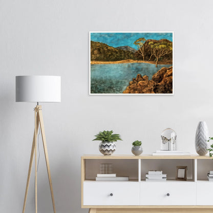 Blue lake with rocky shore, brown hills, slender trees, and turquoise sky in a quiet landscape.