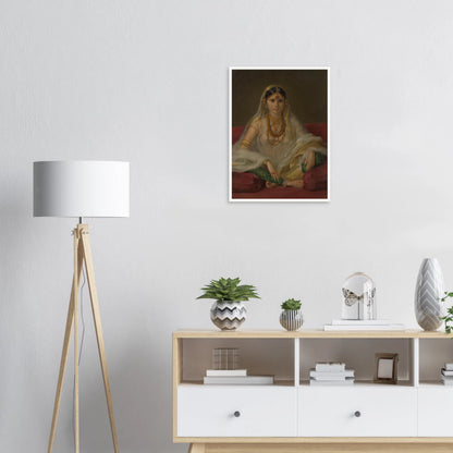 A Mughal woman in a sheer white veil and gold jewelry sits cross-legged on deep red cushions.