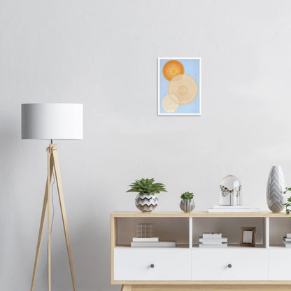 Three overlapping concentric circles in warm orange and beige tones float on a soft blue background like suns in serene orbit.