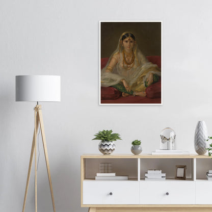 A Mughal woman in a sheer white veil and gold jewelry sits cross-legged on deep red cushions.