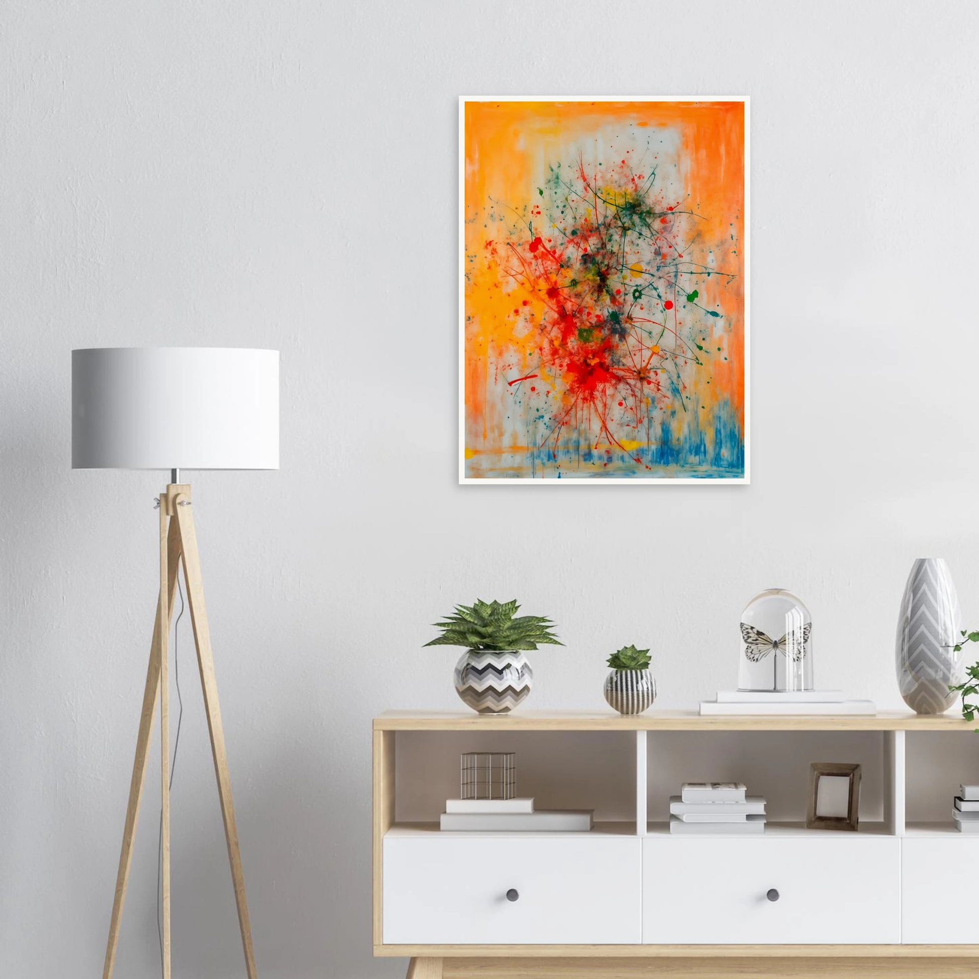 Vivid splashes of red, yellow, blue, and green burst across an orange canvas, evoking movement, chaos, and creative energy.