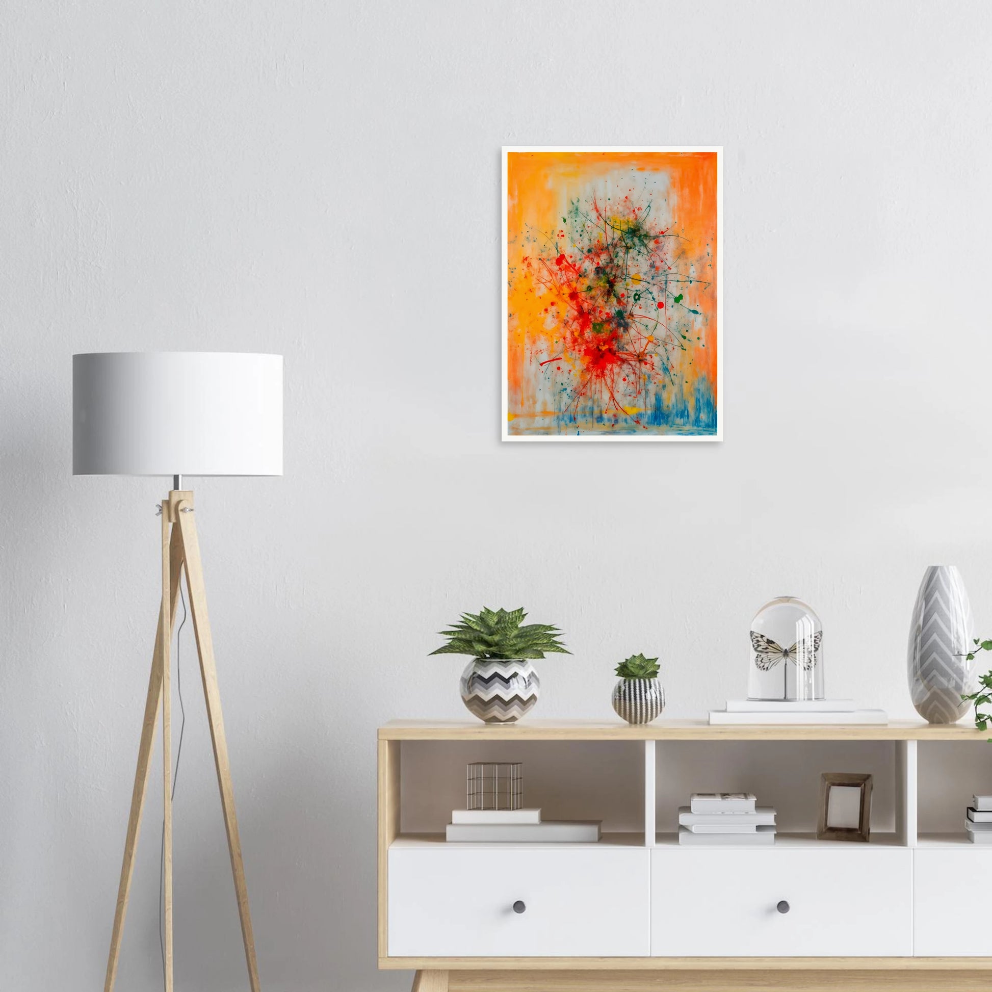 Vivid splashes of red, yellow, blue, and green burst across an orange canvas, evoking movement, chaos, and creative energy.
