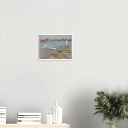 Sailboats rest at low tide near Riverside Yacht Club under hazy blue skies