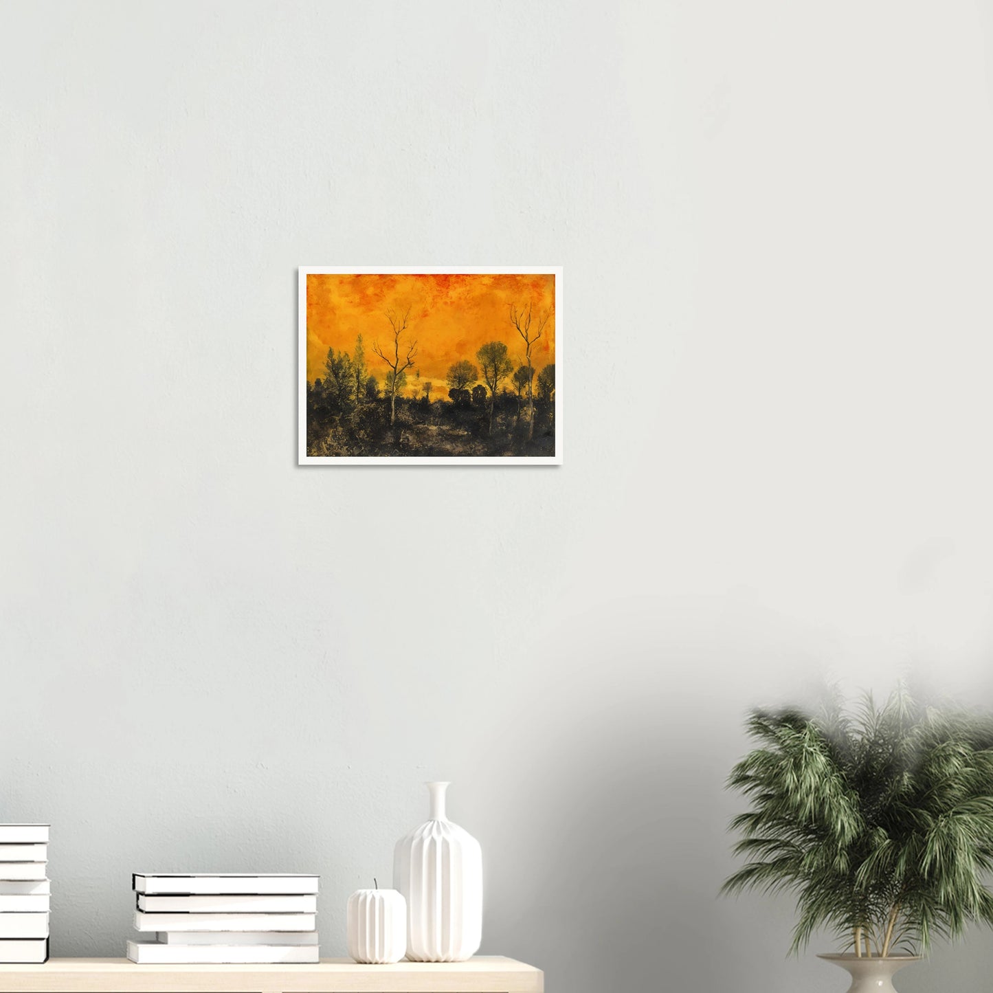 A forest silhouetted against a blazing orange sky, with leafless and leafy trees under a textured sunset.