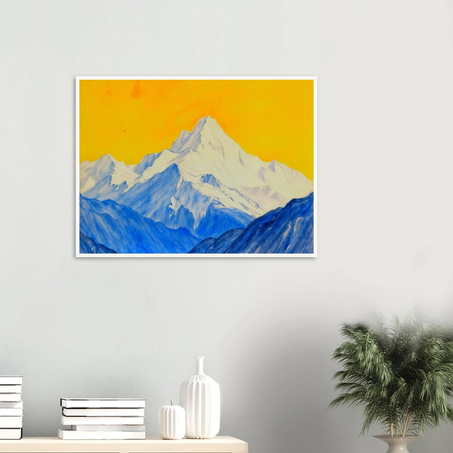 Snowy blue mountain ranges rise beneath a brilliant golden sky, blending icy grandeur with vivid warmth.