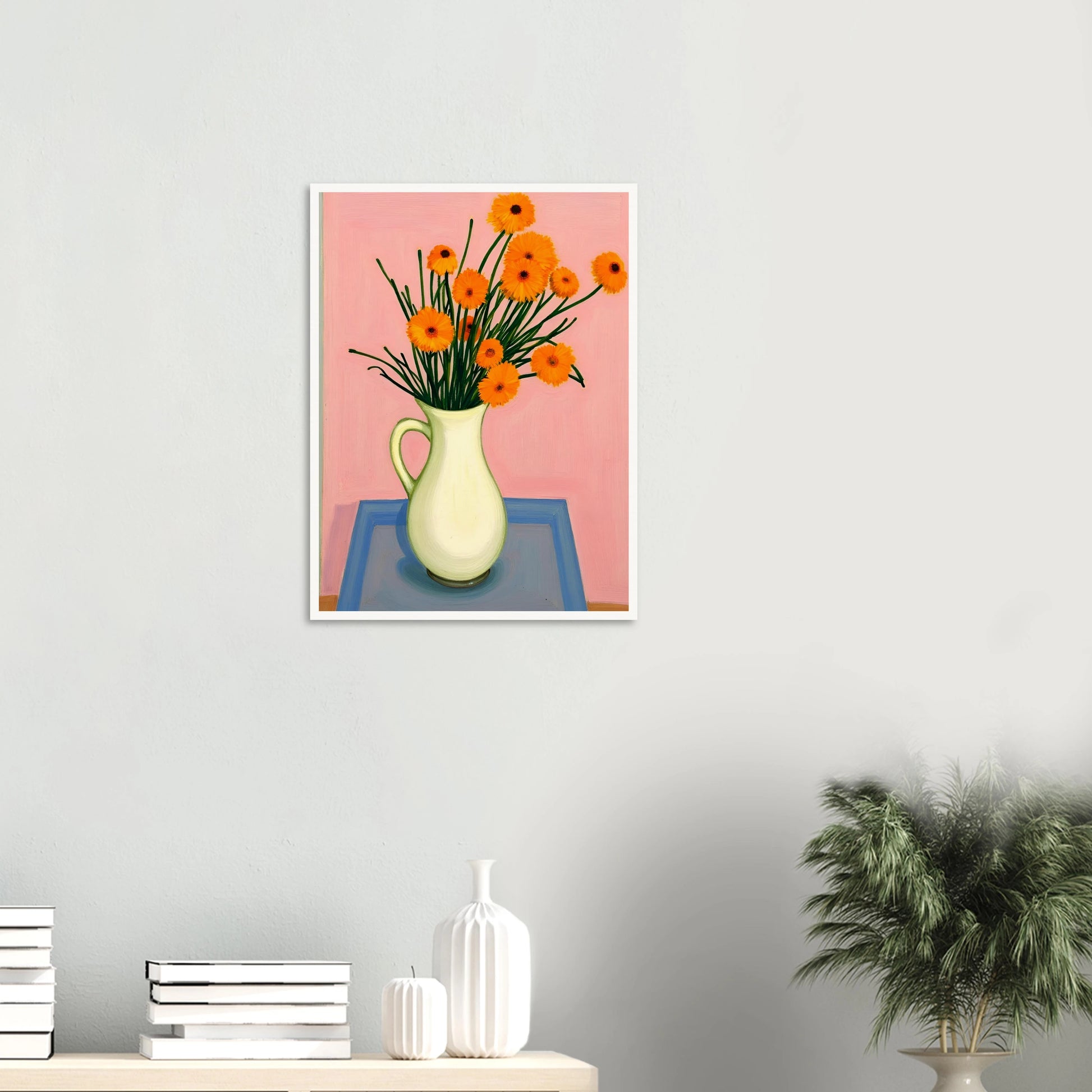 A vase of orange daisies with green stems against a soft pink background, radiating warmth and joy on a pastel tabletop.