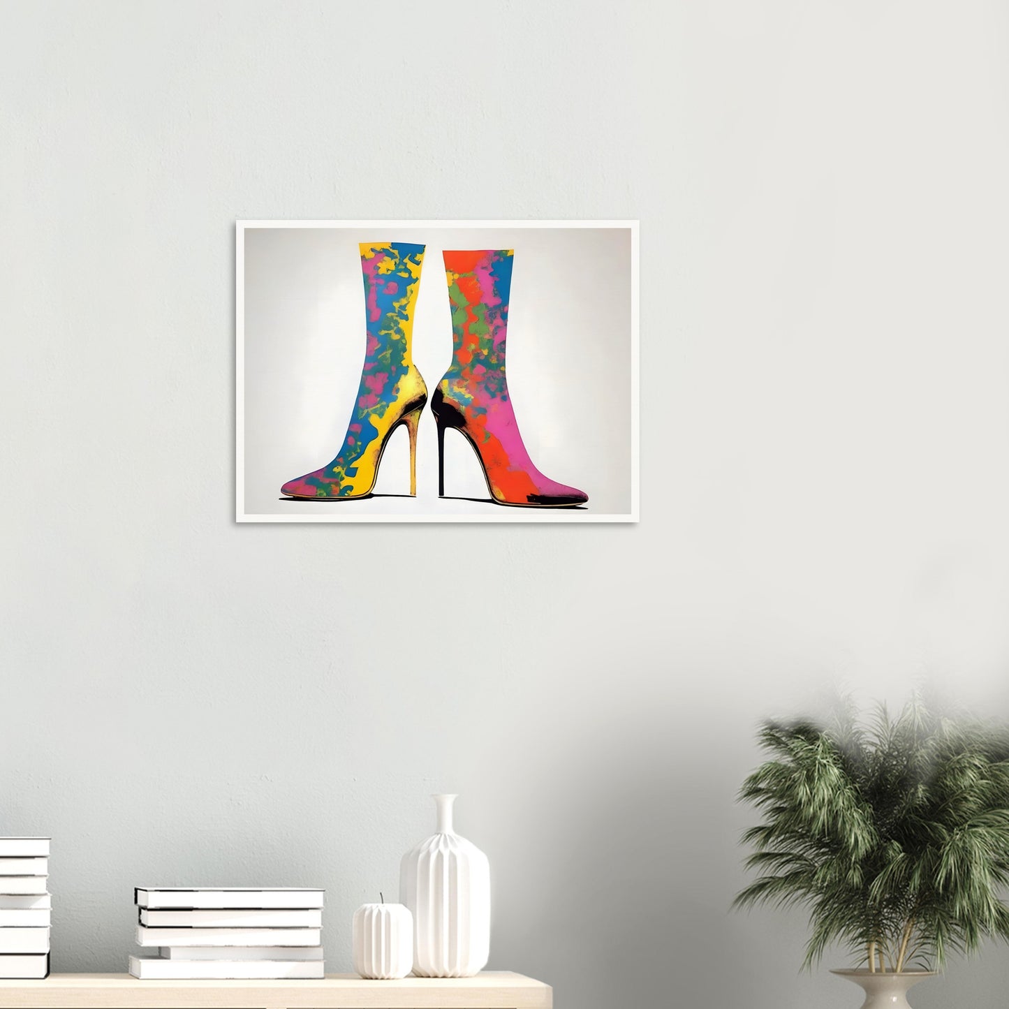 Vibrant high-heeled boots adorned with splashes of bold colors, creating a striking and fashionable design on a neutral background.