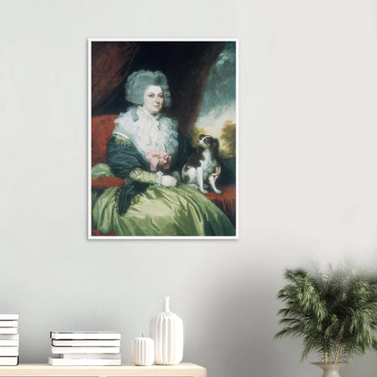 Woman in a green dress sits beside a small black and white dog in a formal portrait