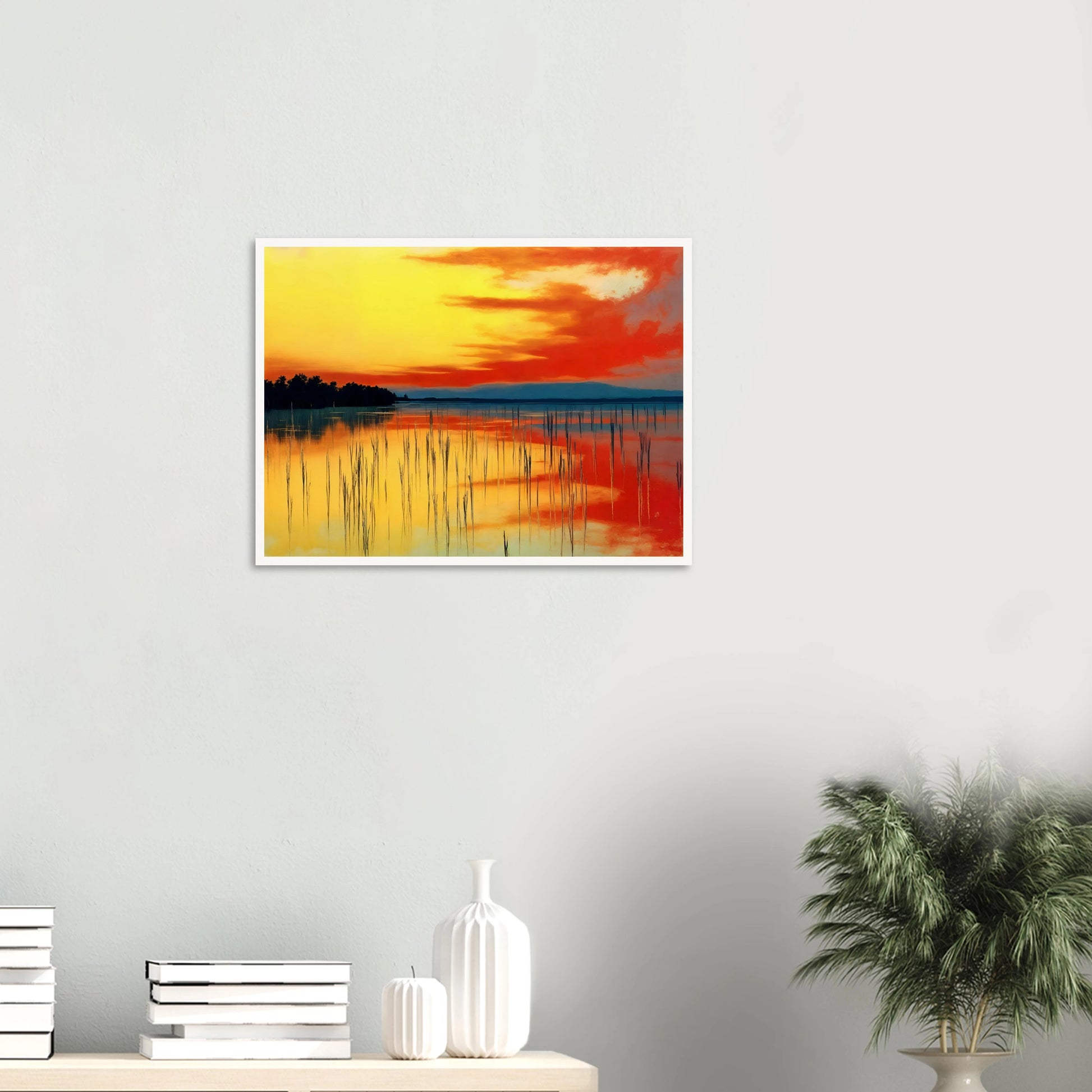 A vivid sunset over calm waters, where orange and yellow hues mirror the sky’s fiery glow and reeds stand in quiet balance.