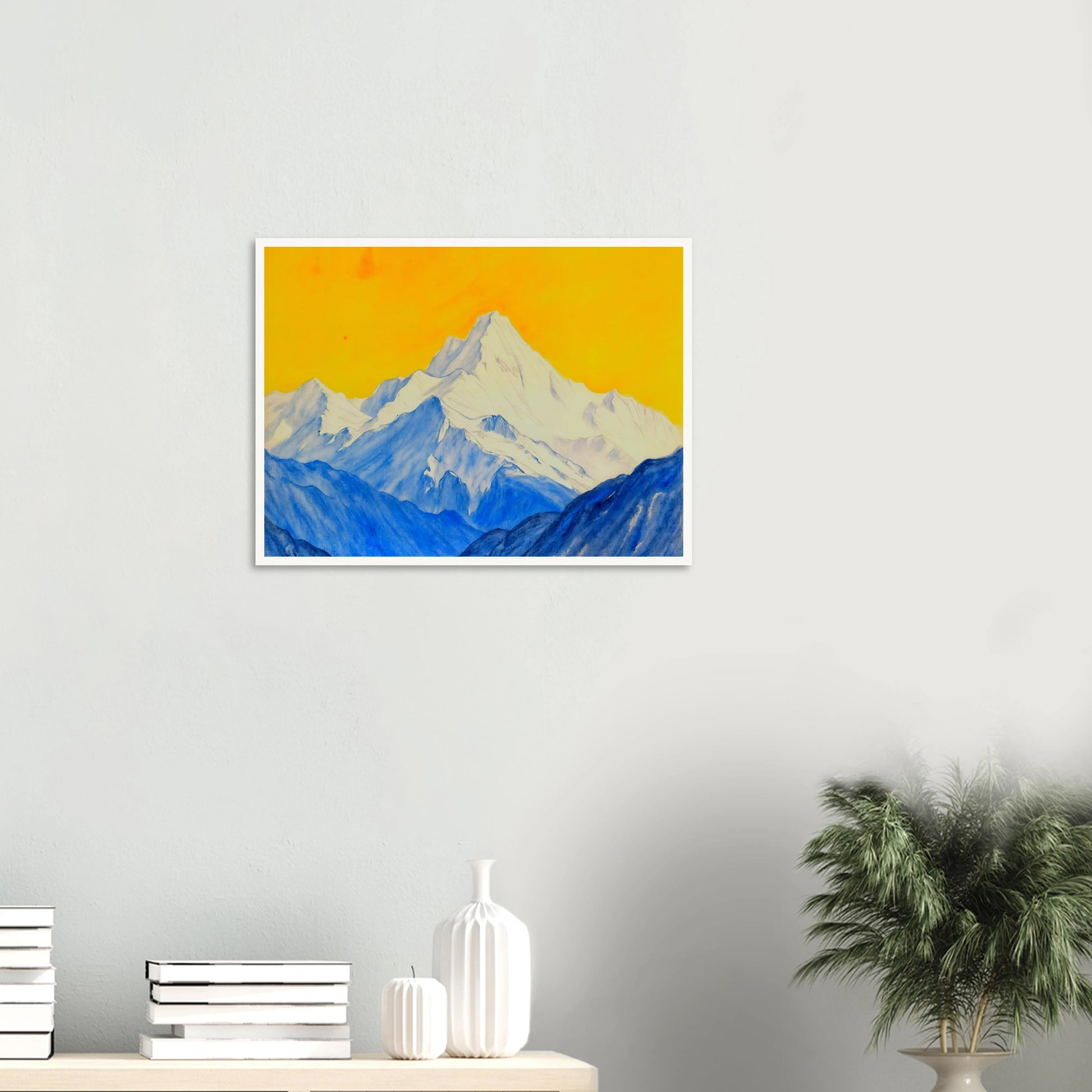 Snowy blue mountain ranges rise beneath a brilliant golden sky, blending icy grandeur with vivid warmth.