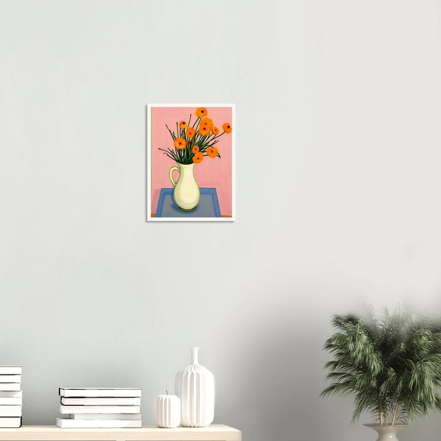 A vase of orange daisies with green stems against a soft pink background, radiating warmth and joy on a pastel tabletop.